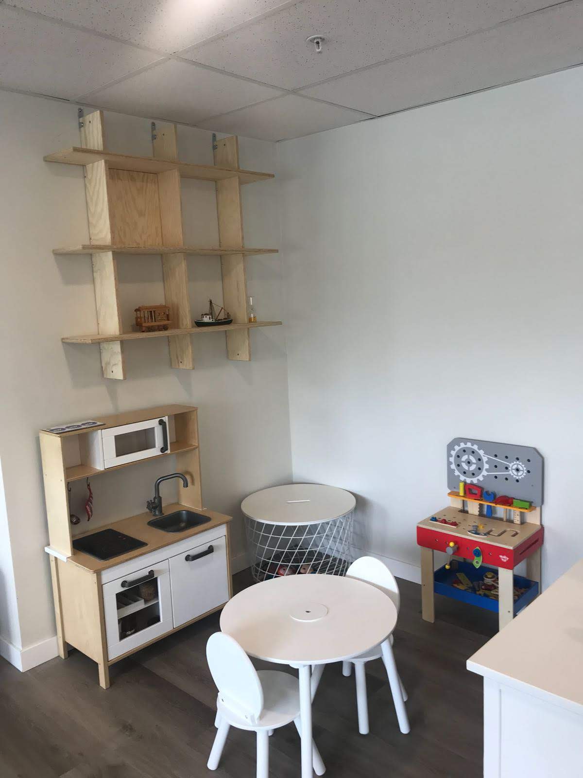 Children's play kitchen and learning area at Hundred Languages Child Care daycare